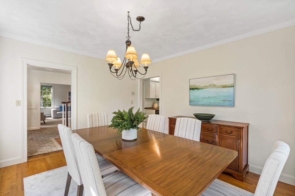 9 Deepwoods Drive Natick, MA 01760 - Photo 7 of 31 a view of a dining room with furniture and chandelier
