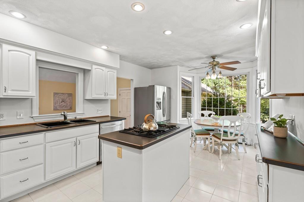 9 Deepwoods Drive Natick, MA 01760 - Photo 10 of 31 a kitchen with a sink and cabinets