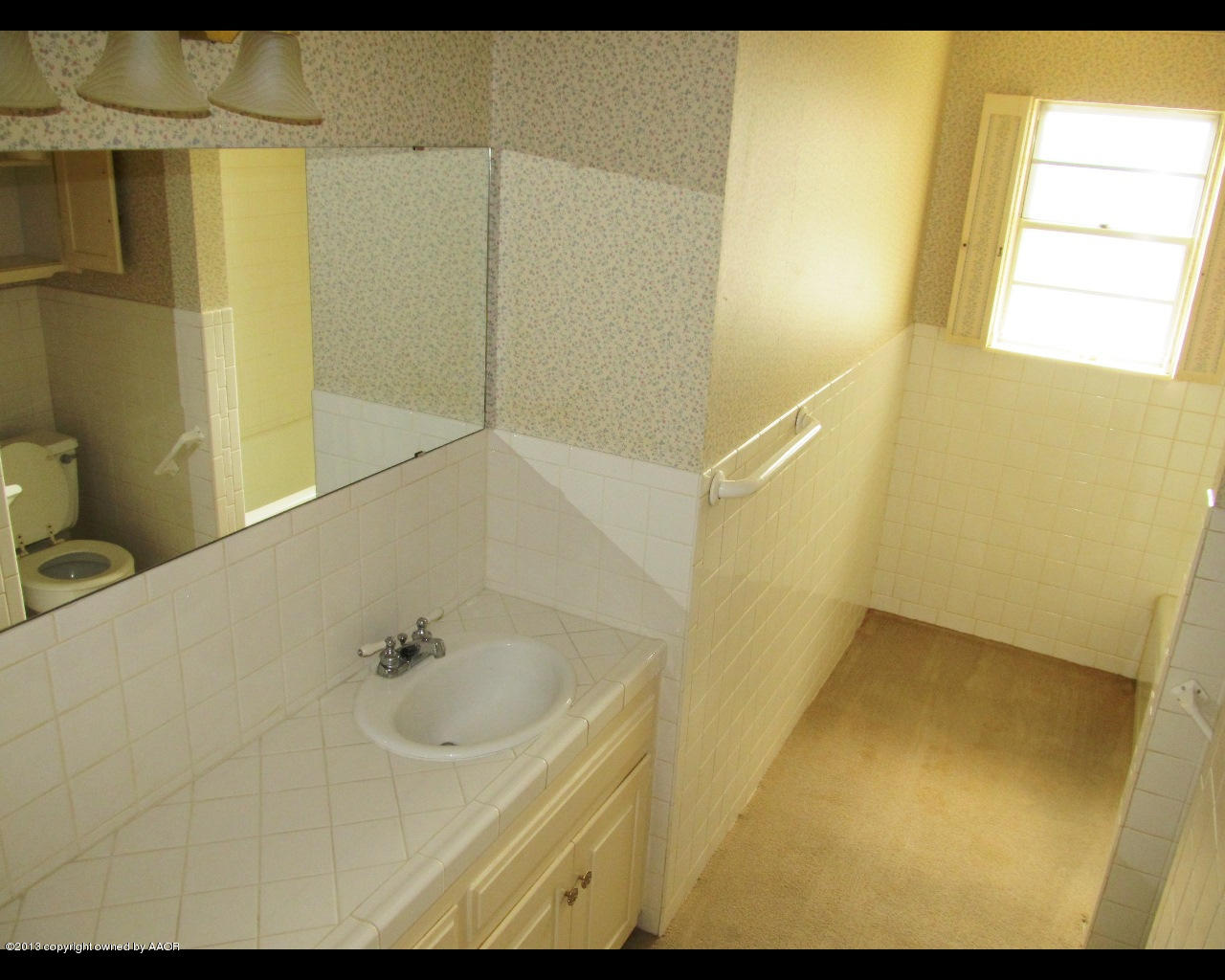 6707 Elmhurst Road Amarillo, TX 79106 - Photo 13 of 21 a bathroom with a sink and a shower