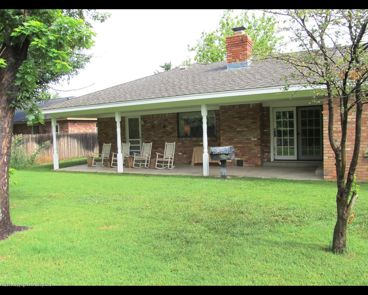 6707 Elmhurst Road Amarillo, TX 79106 - Photo 19 of 21 a backyard of a house with table and chairs