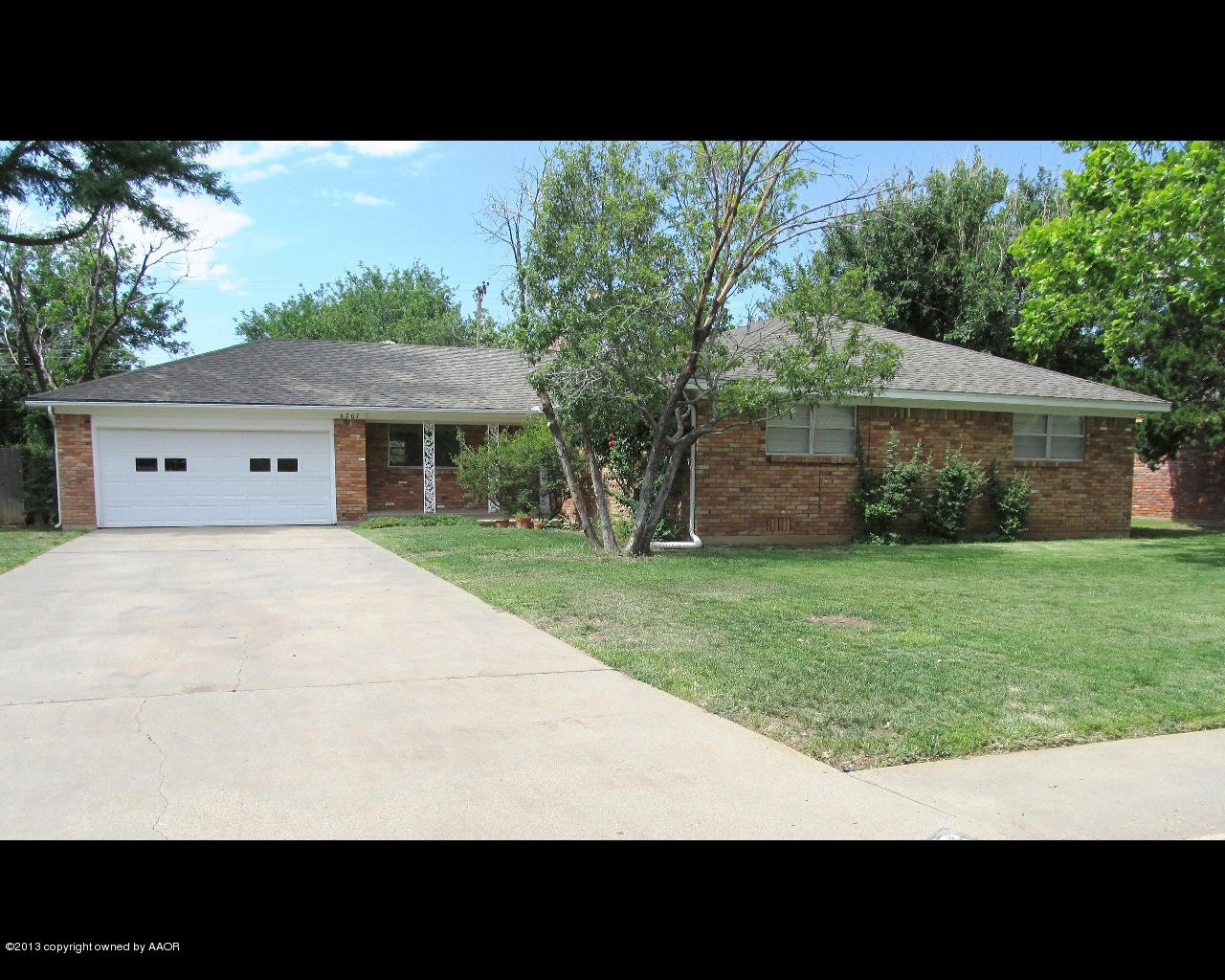 6707 Elmhurst Road Amarillo, TX 79106 - Photo 2 of 21 a view of house with yard