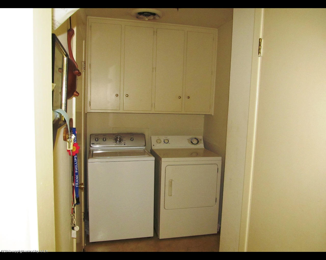 6707 Elmhurst Road Amarillo, TX 79106 - Photo 9 of 21 a utility room with dryer and washer
