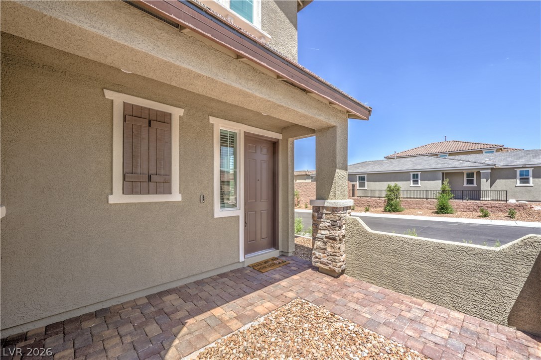 3782 Alla Rocca Avenue Henderson, NV 89044 - Photo 4 of 55 Welcome to a charming residence featuring a warm entryway and delightful architectural accents.