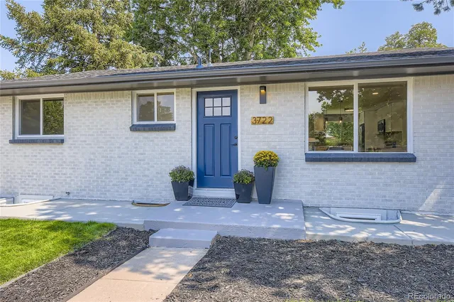 a view of a bird house next to a road