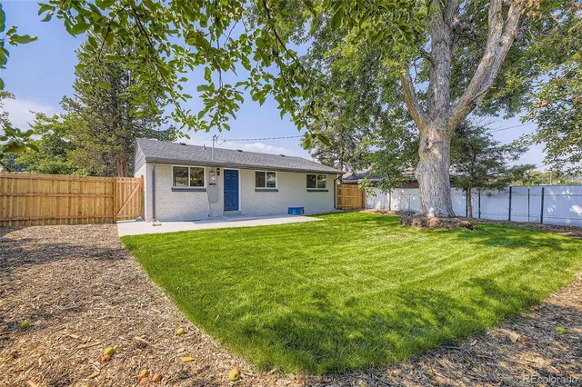 a kitchen view with wooden floor and glass windows