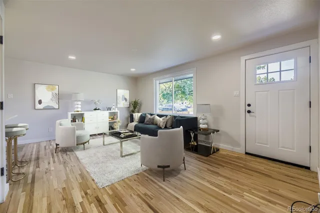 a kitchen with a sink white cabinets and appliances