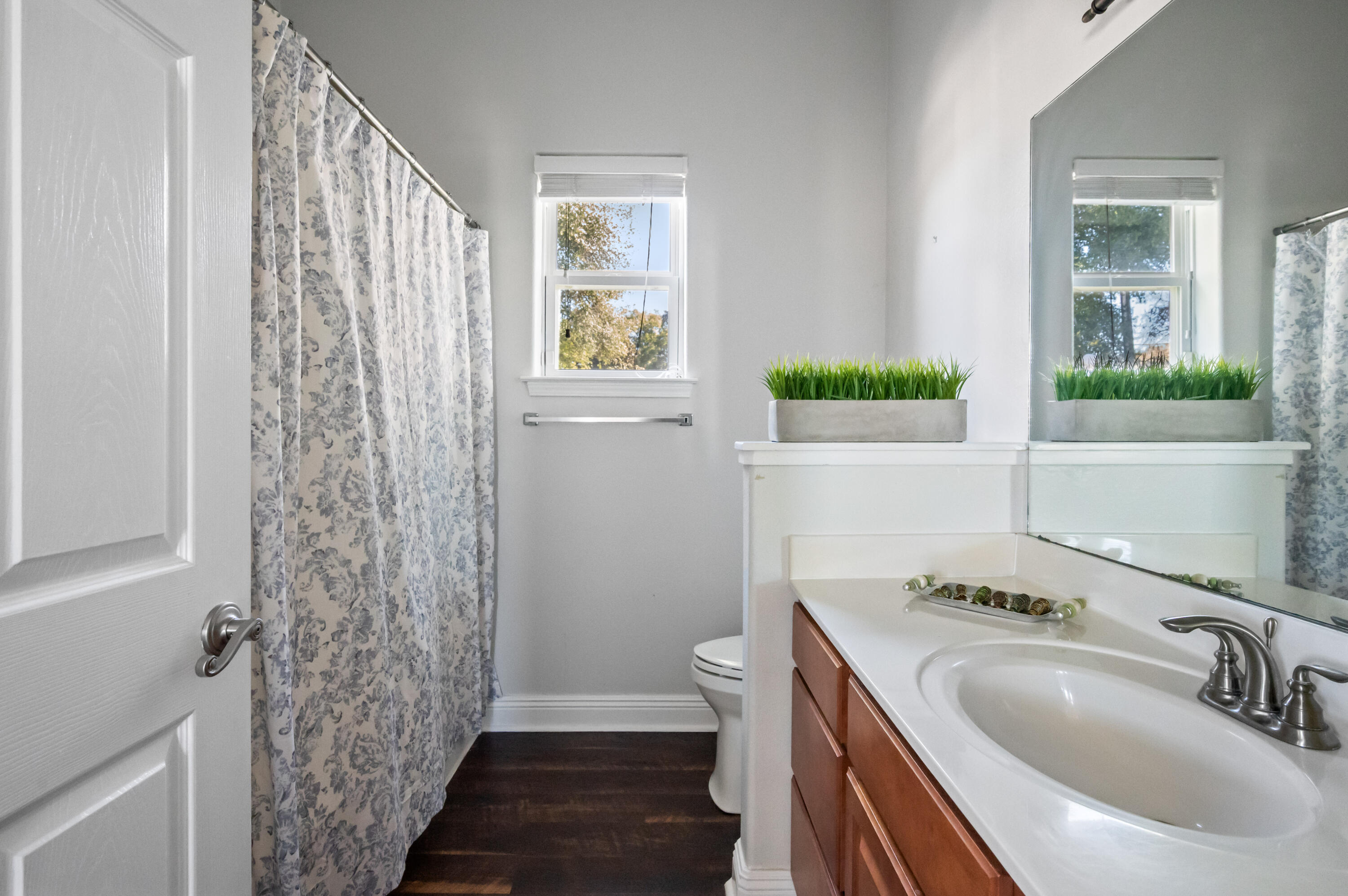 722 Kelly Street Destin, FL 32541 - Photo 28 of 54 a bathroom with a sink a toilet and shower