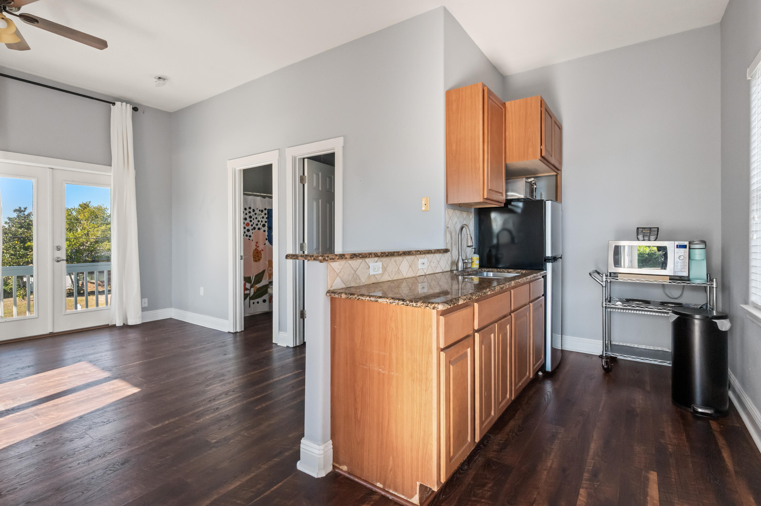 722 Kelly Street Destin, FL 32541 - Photo 32 of 54 a kitchen with stainless steel appliances granite countertop a stove a sink and a refrigerator