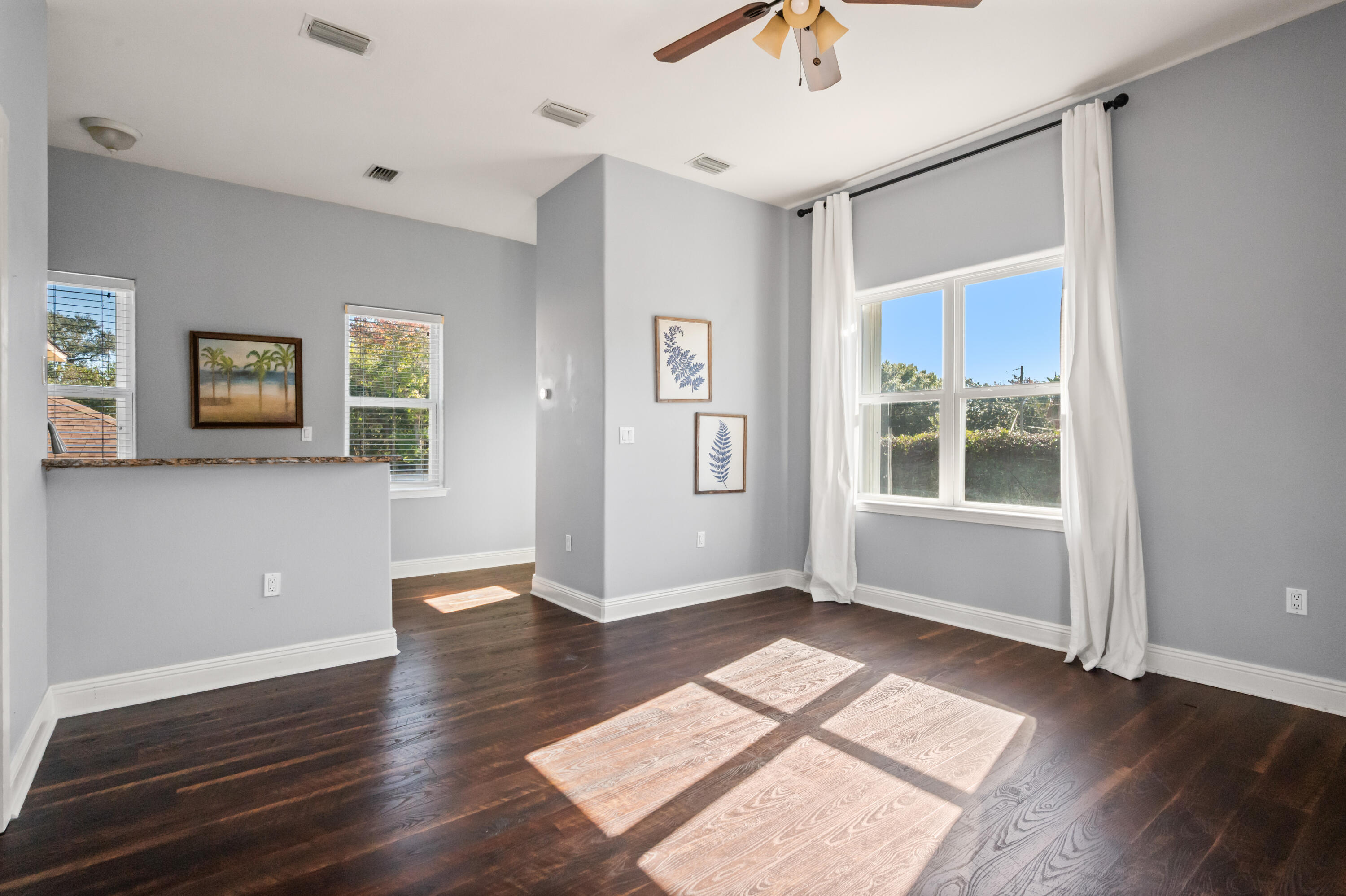722 Kelly Street Destin, FL 32541 - Photo 35 of 54 wooden floor in an empty room with a window