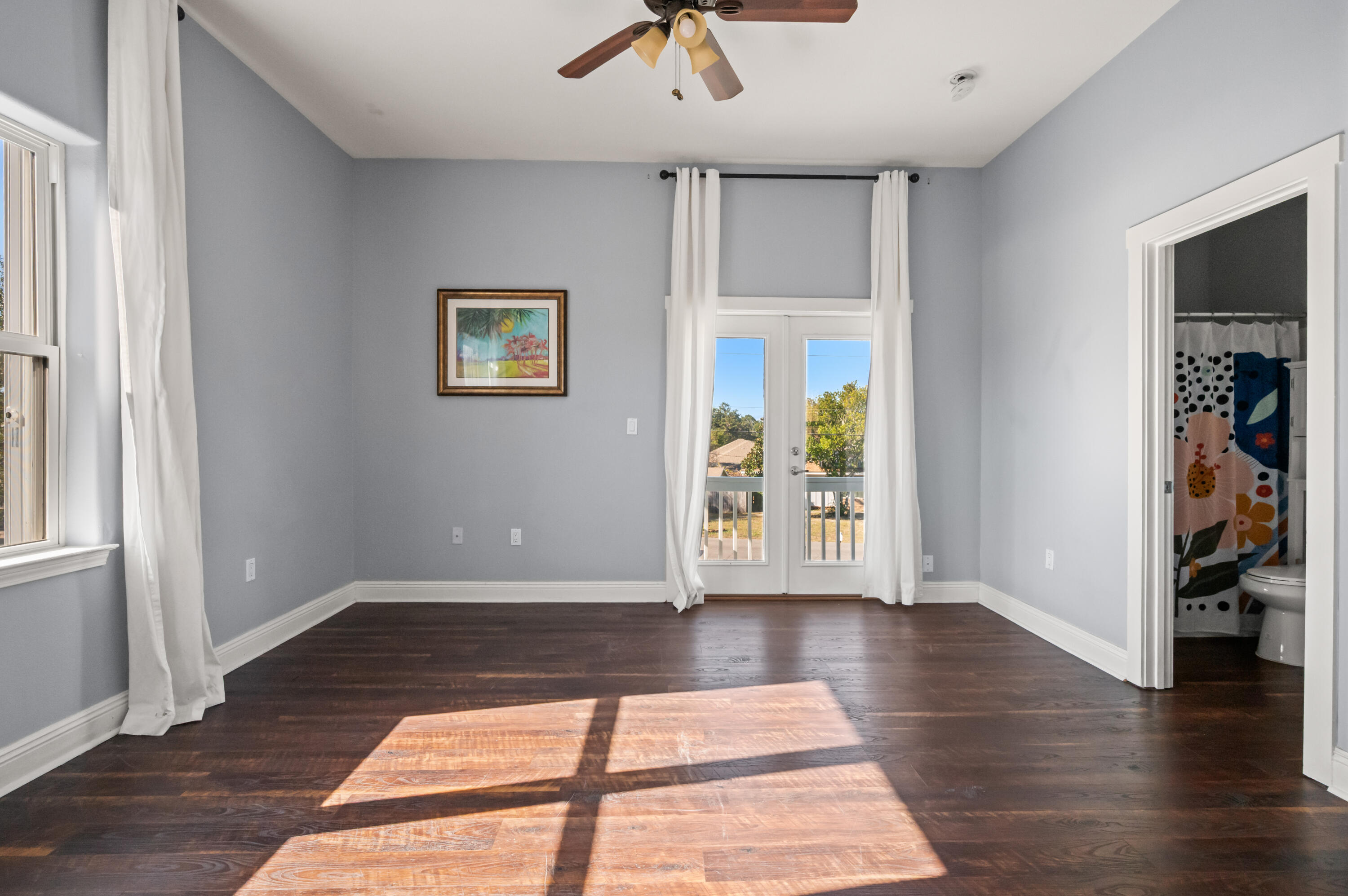 722 Kelly Street Destin, FL 32541 - Photo 40 of 54 wooden floor in an empty room with a window