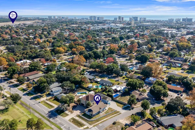 an aerial view of residential houses with outdoor space