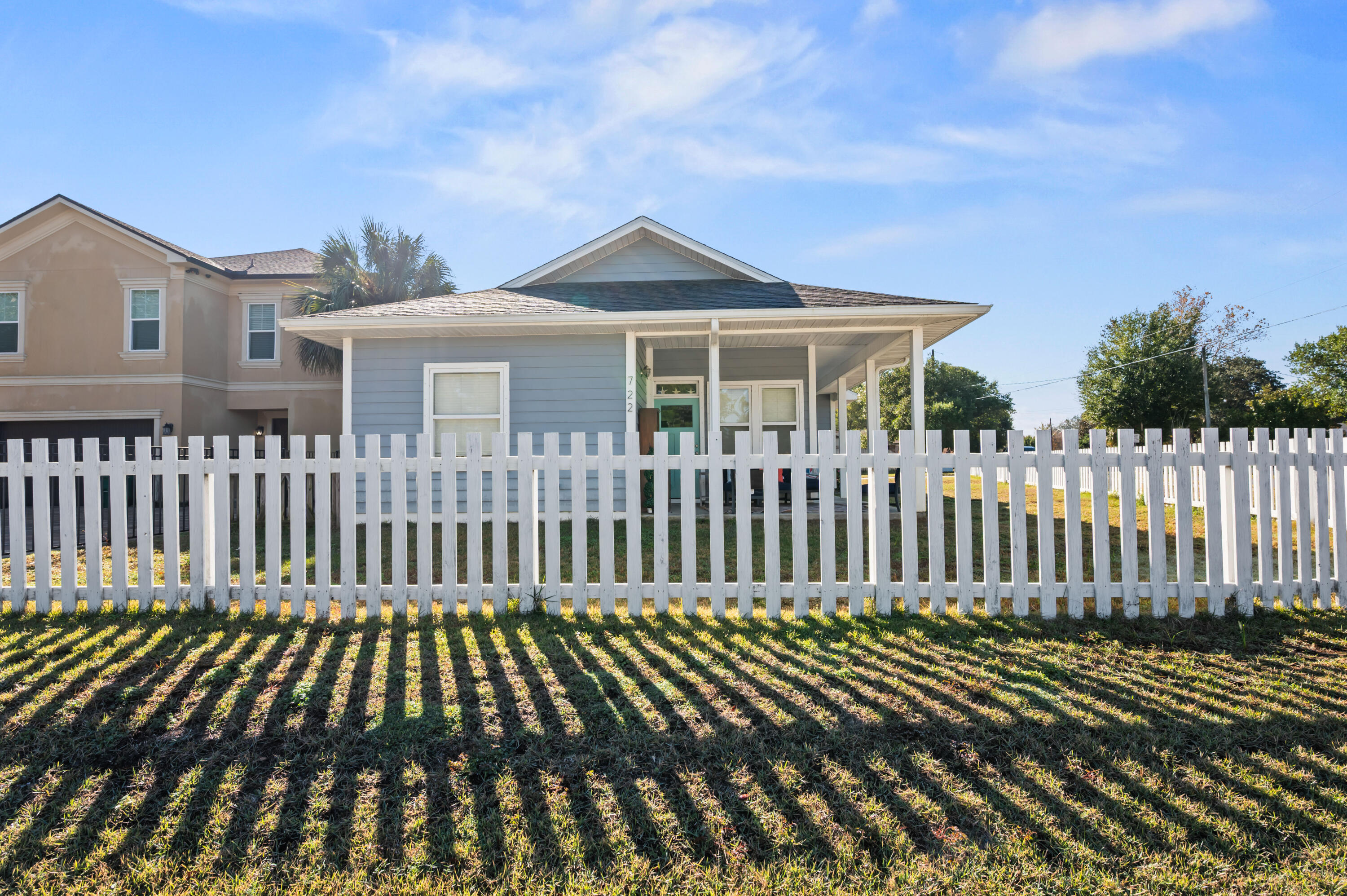 722 Kelly Street Destin, FL 32541 - Photo 5 of 54 a front view of a house with a garden