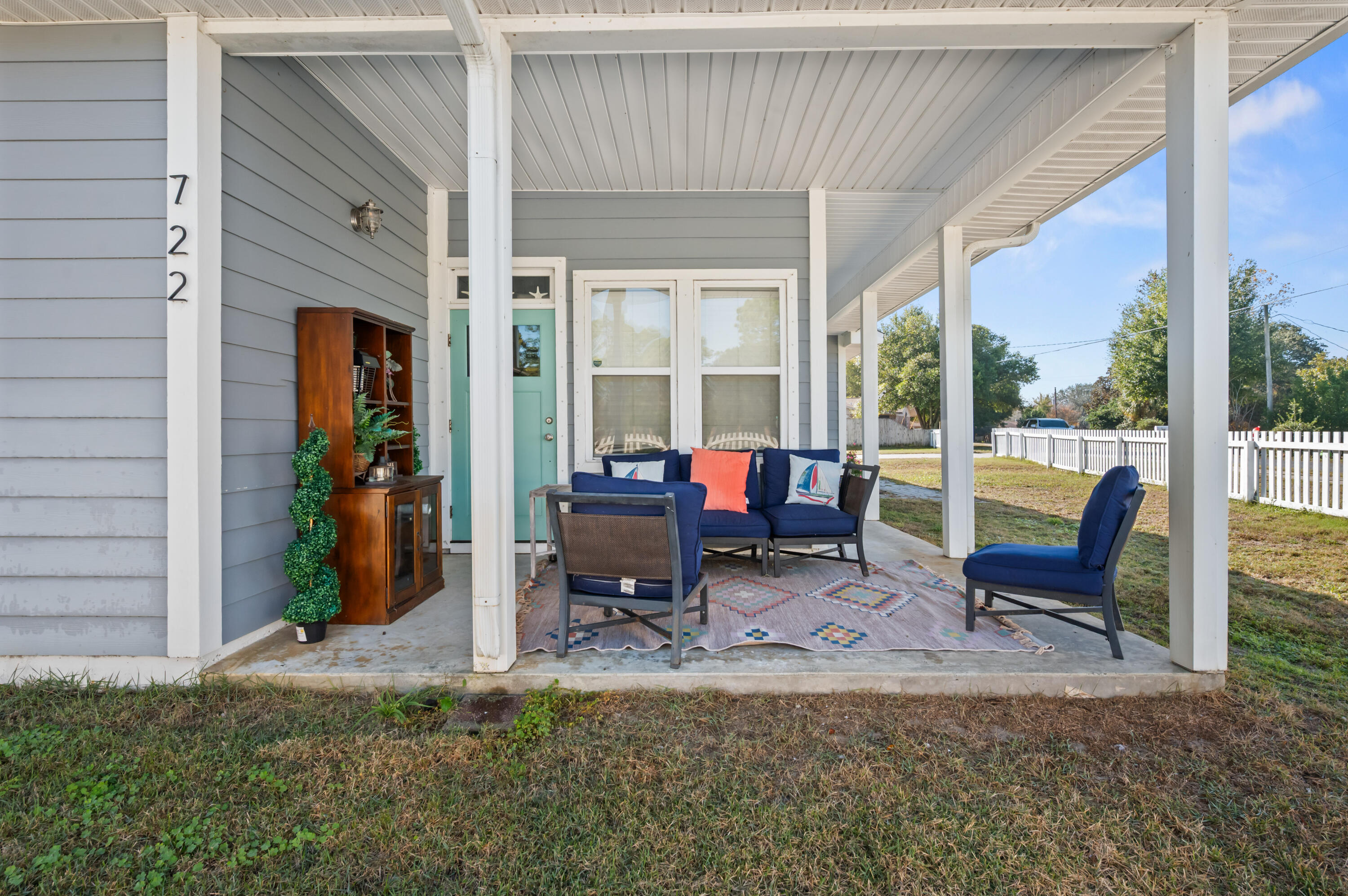 722 Kelly Street Destin, FL 32541 - Photo 7 of 54 a view of a patio with table and chairs and floor to ceiling window