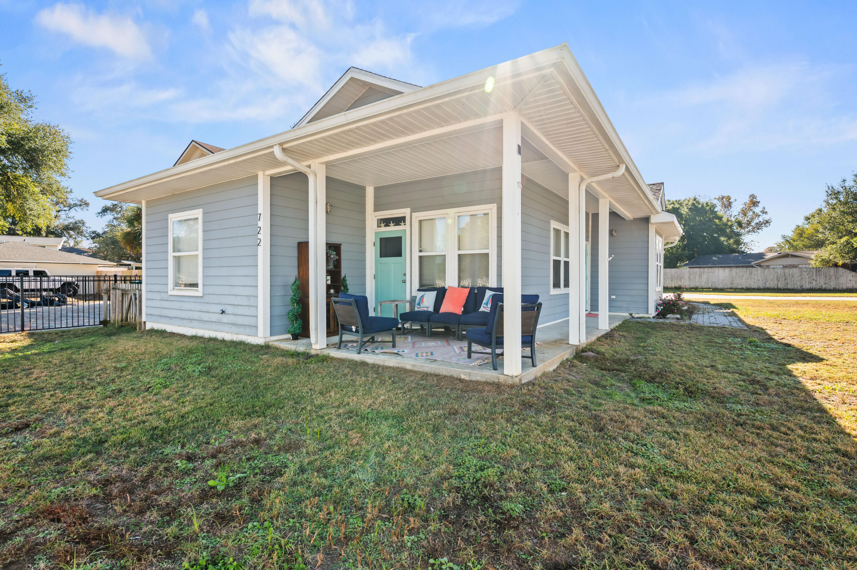 722 Kelly Street Destin, FL 32541 - Photo 8 of 54 a view of a house with porch and garden