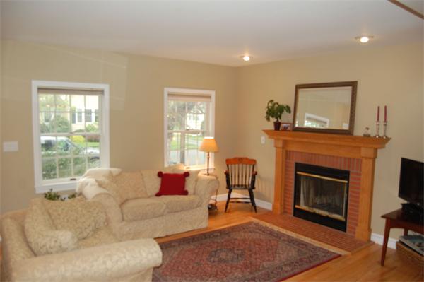 7 Glendale Road Marblehead, MA 01945 - Photo 2 of 15 a living room with furniture a window and a fireplace