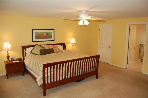 7 Glendale Road Marblehead, MA 01945 - Photo 6 of 15 a bedroom with a bed and a chandelier