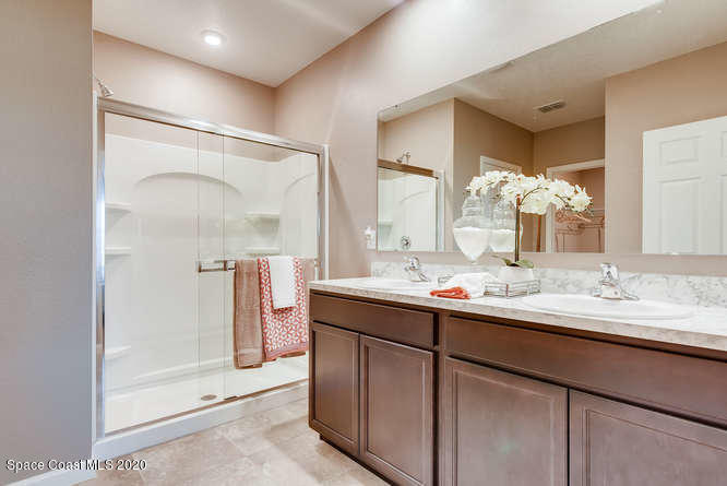 2864 Digby Road Southeast Palm Bay, FL 32909 - Photo 9 of 17 a bathroom with a double vanity sink mirror and double