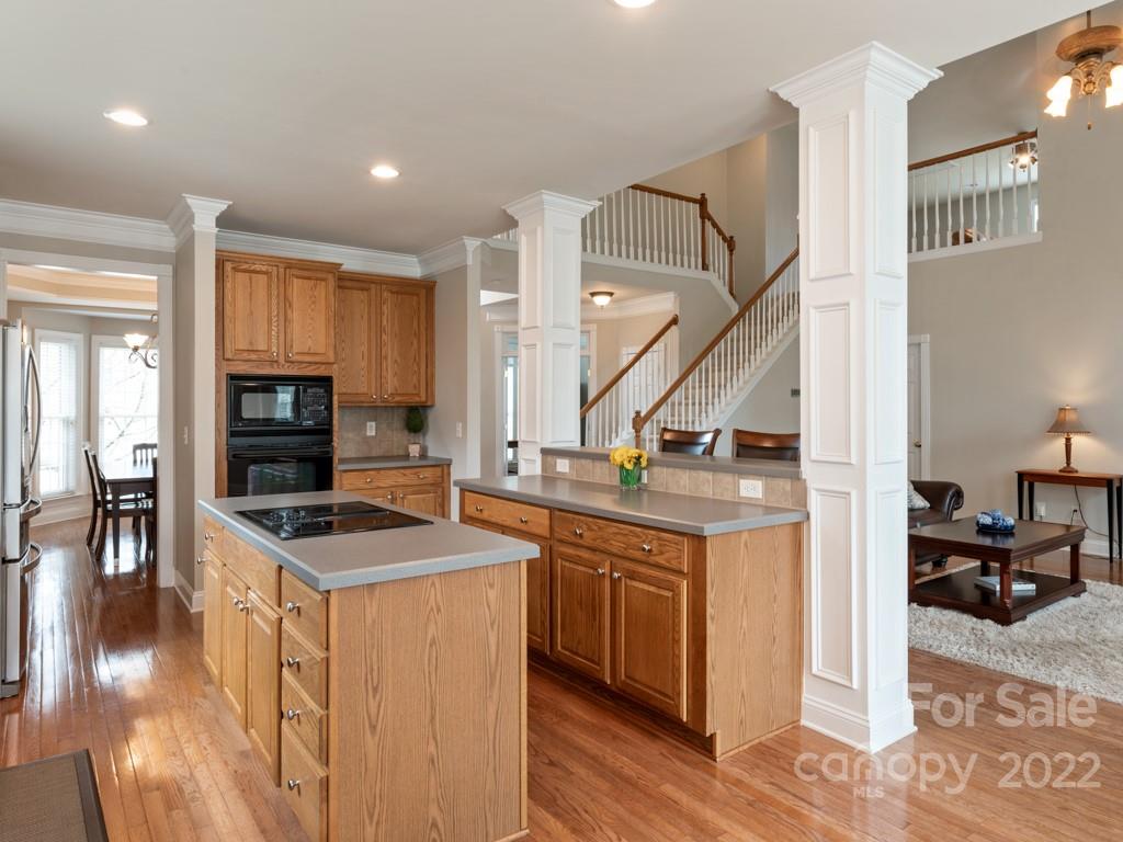 8603 Dansington Court Waxhaw, NC 28173 - Photo 12 of 45 a kitchen with stainless steel appliances granite countertop a stove and a sink