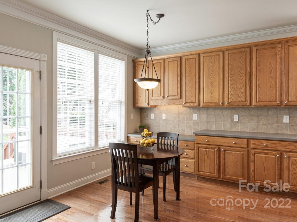 8603 Dansington Court Waxhaw, NC 28173 - Photo 13 of 45 a view of a dining room with furniture window and wooden floor