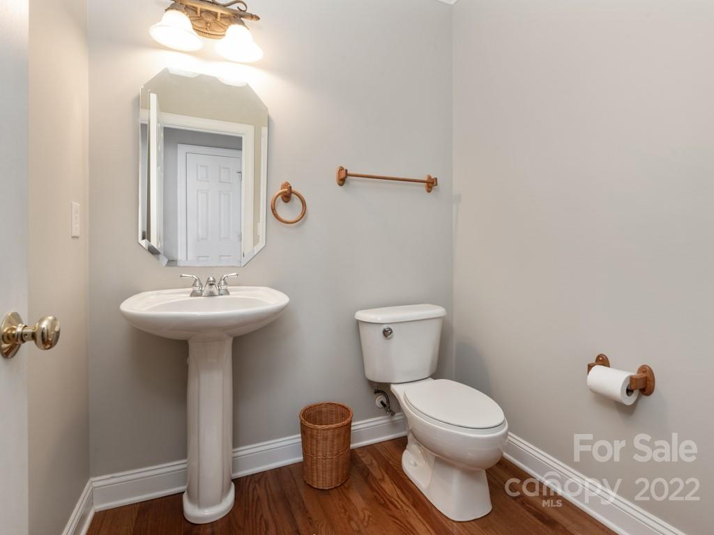 8603 Dansington Court Waxhaw, NC 28173 - Photo 20 of 45 a bathroom with a toilet a sink and mirror