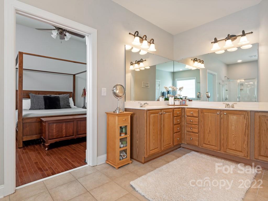 8603 Dansington Court Waxhaw, NC 28173 - Photo 23 of 45 a bathroom with a sink and a mirror