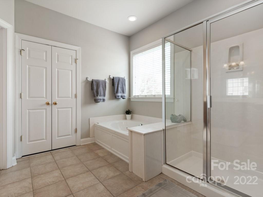 8603 Dansington Court Waxhaw, NC 28173 - Photo 25 of 45 a spacious bathroom with a shower and a sink