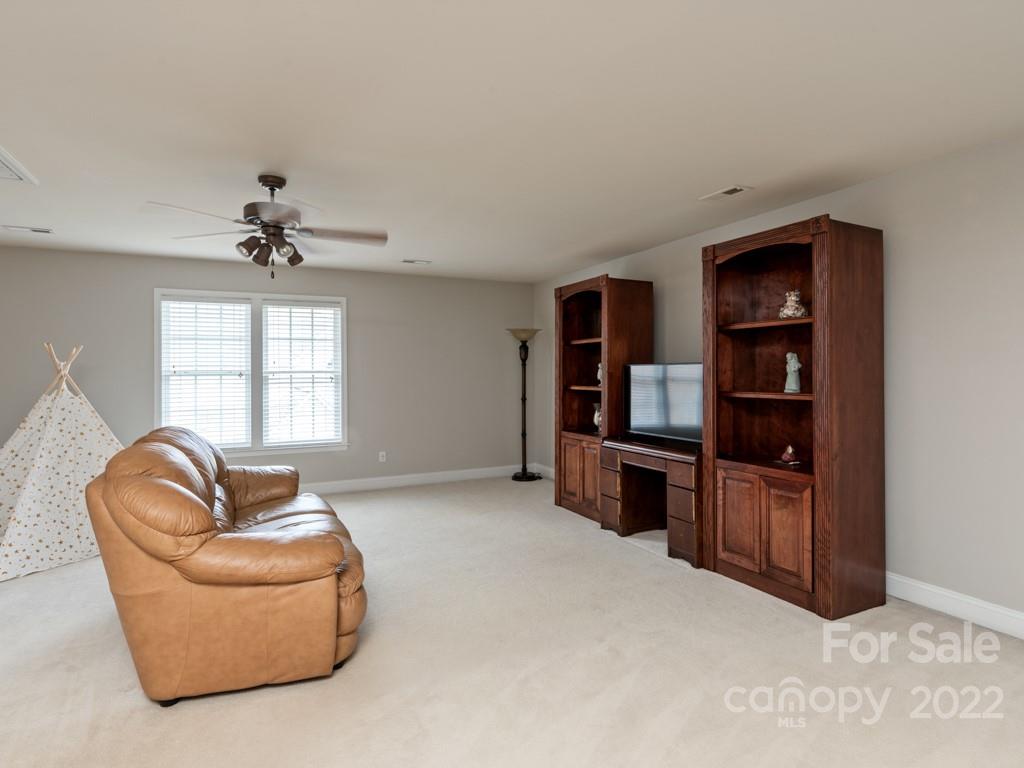 8603 Dansington Court Waxhaw, NC 28173 - Photo 29 of 45 a living room with furniture and a window