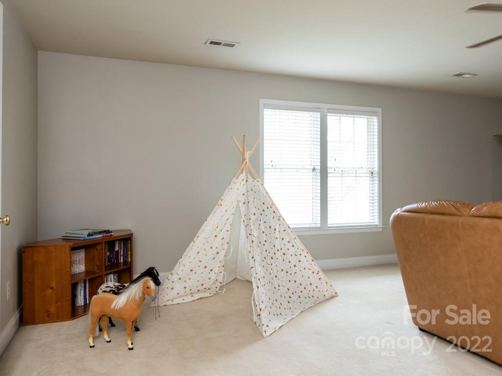 8603 Dansington Court Waxhaw, NC 28173 - Photo 30 of 45 a living room with furniture and a large window