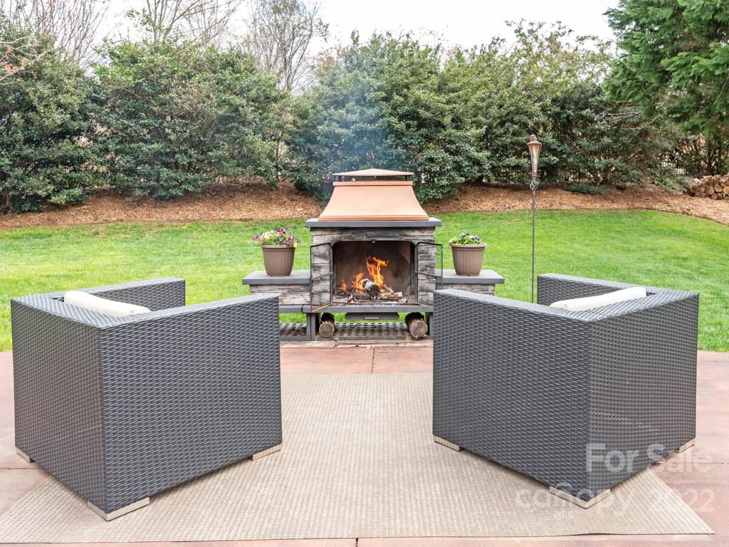 8603 Dansington Court Waxhaw, NC 28173 - Photo 40 of 45 an outdoor sitting area with a table and chairs