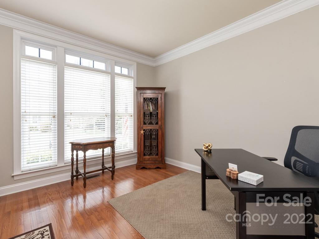 8603 Dansington Court Waxhaw, NC 28173 - Photo 4 of 45 a view of a workspace with furniture and a window
