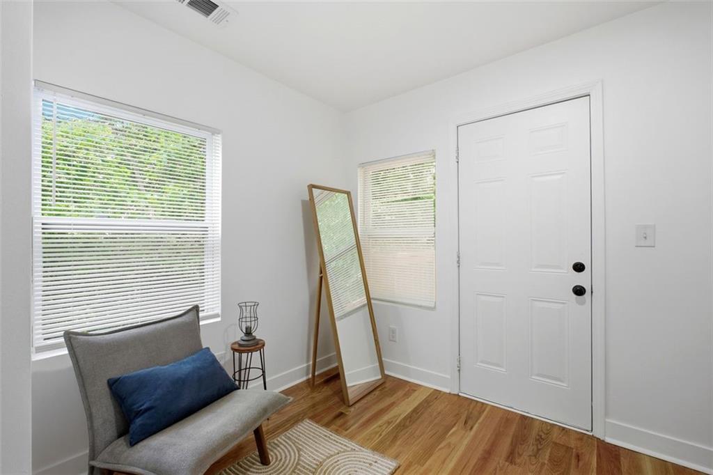 965 Houston Mill Road Northeast Atlanta, GA 30329 - Photo 19 of 42 a view of a room with a window and wooden floor