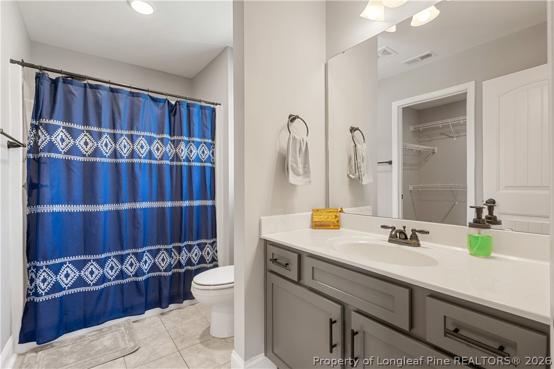 137 Minter School Road Sanford, NC 27332 - Photo 30 of 50 a bathroom with a sink a toilet and shower