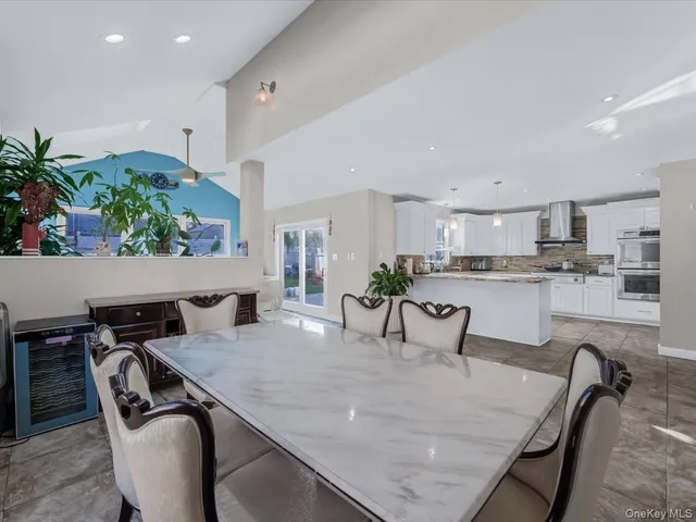 a kitchen with a table and chairs in it
