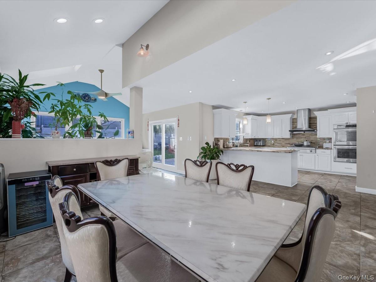 217-32 Corbett Road Queens, NY 11361 - Photo 11 of 25 a kitchen with a table and chairs in it