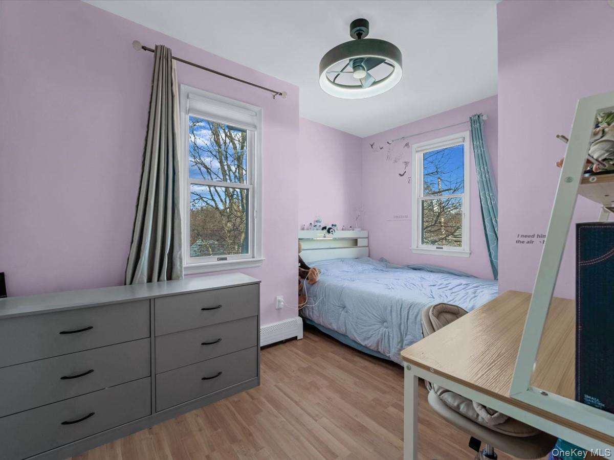 217-32 Corbett Road Queens, NY 11361 - Photo 15 of 25 a bedroom with two beds and a window