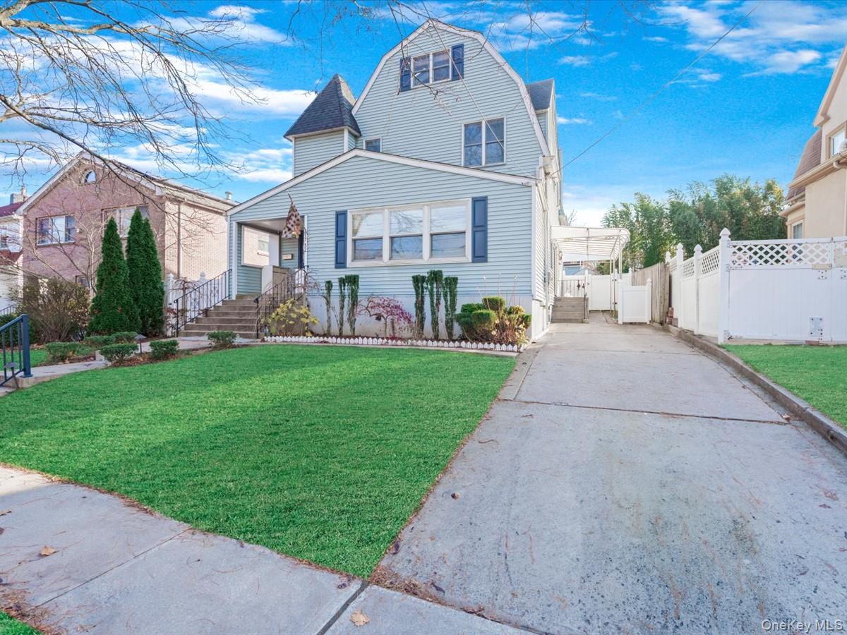 217-32 Corbett Road Queens, NY 11361 - Photo 2 of 25 a front view of building with garden