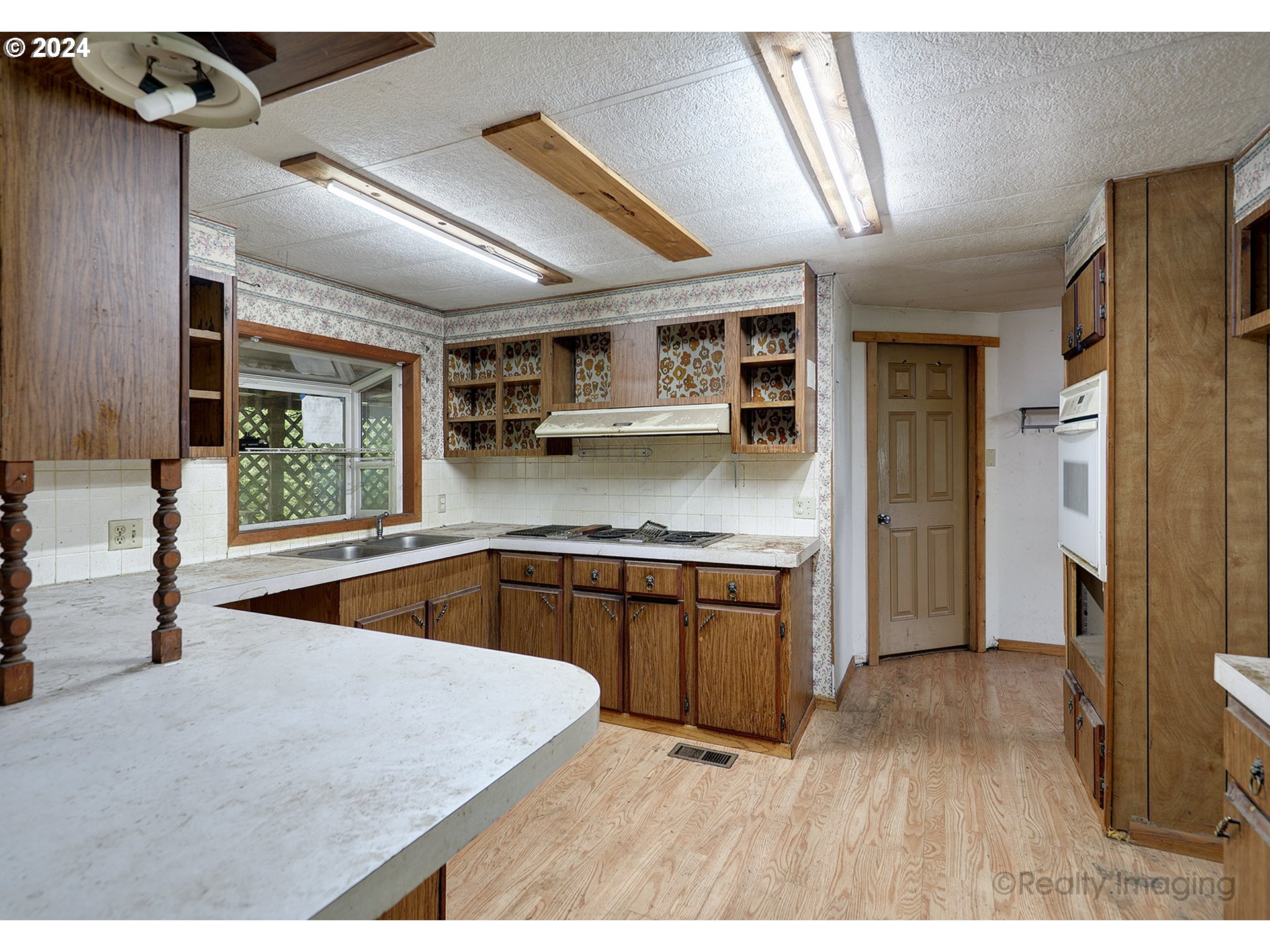 48886 Southeast Coalman Road Sandy, OR 97055 - Photo 5 of 16 a kitchen with stainless steel appliances granite countertop a sink and a granite counter tops