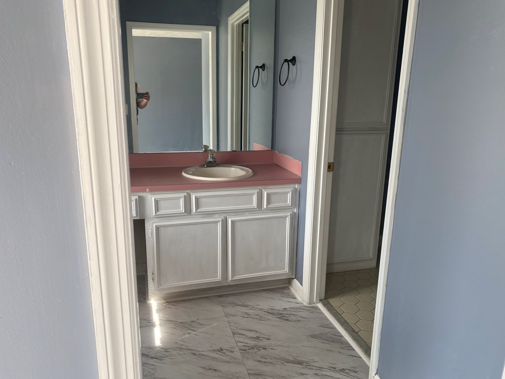 1429 14th Street Columbus, GA 31901 - Photo 4 of 11 a view of a bathroom with a sink and a mirror