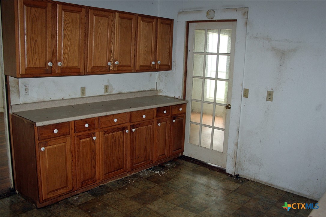 108 Sorrell Street Red Rock, TX 78662 - Photo 26 of 36 a view of a kitchen with wooden cabinet