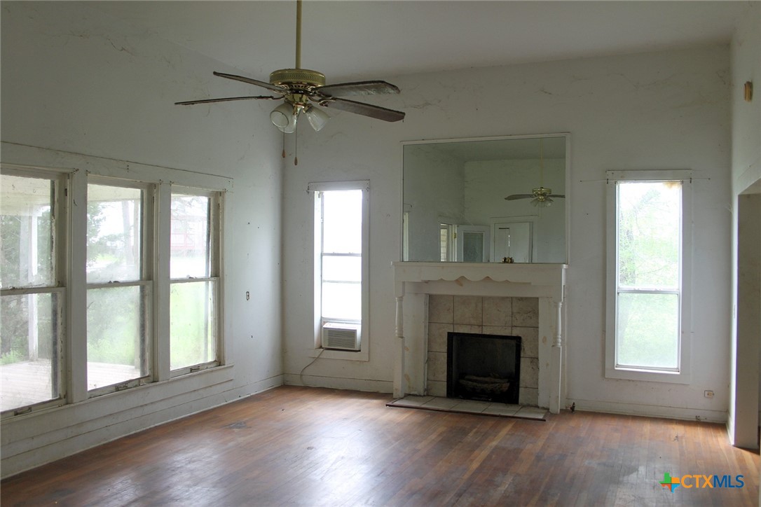 108 Sorrell Street Red Rock, TX 78662 - Photo 27 of 36 a view of a livingroom with a fireplace and window