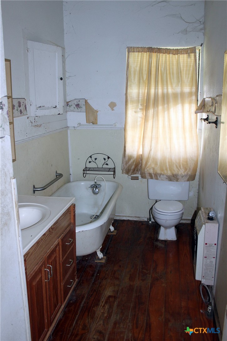 108 Sorrell Street Red Rock, TX 78662 - Photo 29 of 36 a bathroom with a sink toilet and window