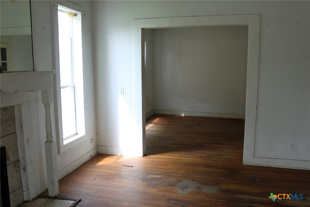 108 Sorrell Street Red Rock, TX 78662 - Photo 33 of 36 a view of an empty room with wooden floor and a window
