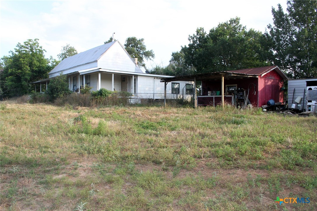 108 Sorrell Street Red Rock, TX 78662 - Photo 6 of 36 a backyard of a house with yard and trampoline