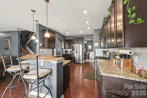a kitchen with stove and cabinets