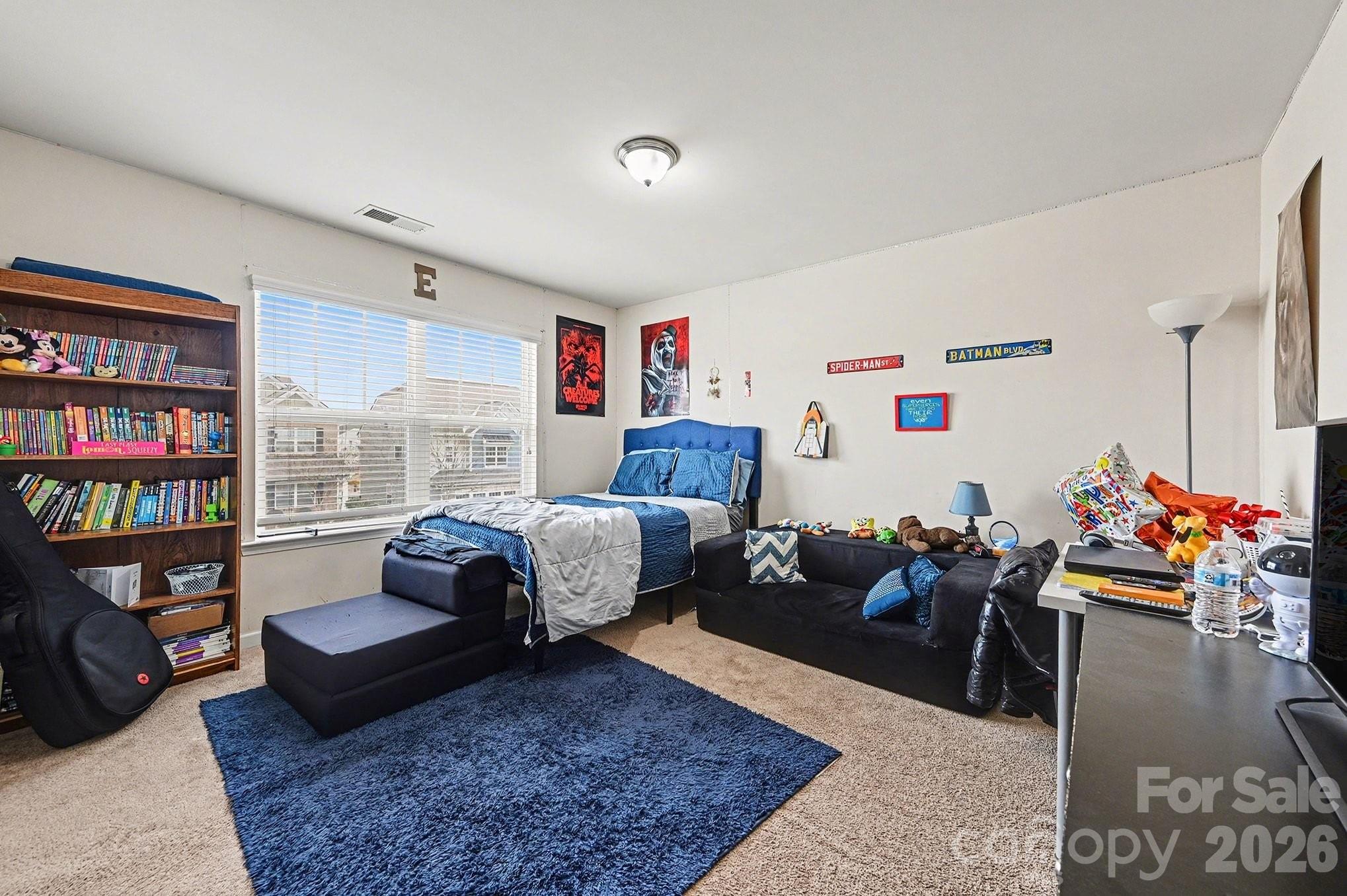 12614 Chantrey Way Huntersville, NC 28078 - Photo 23 of 31 a bedroom with furniture and a book shelf