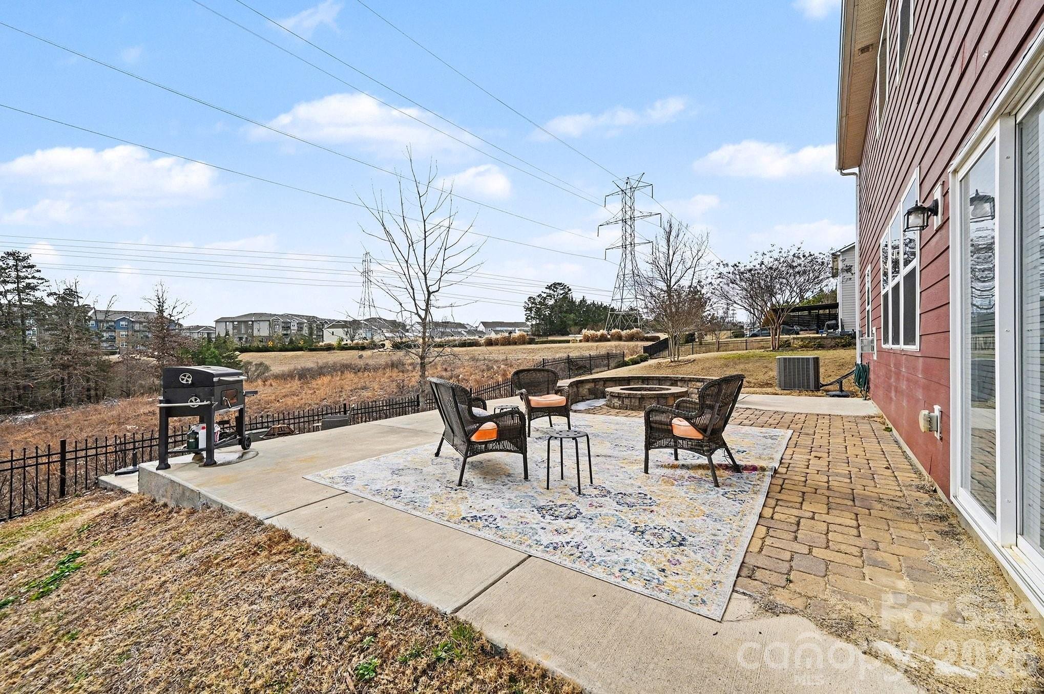 12614 Chantrey Way Huntersville, NC 28078 - Photo 29 of 31 a view of a patio with a table and chairs