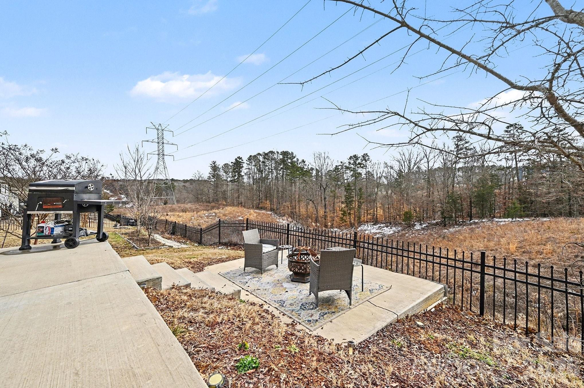 12614 Chantrey Way Huntersville, NC 28078 - Photo 30 of 31 a view of a roof deck with a barbeque and wooden stairs