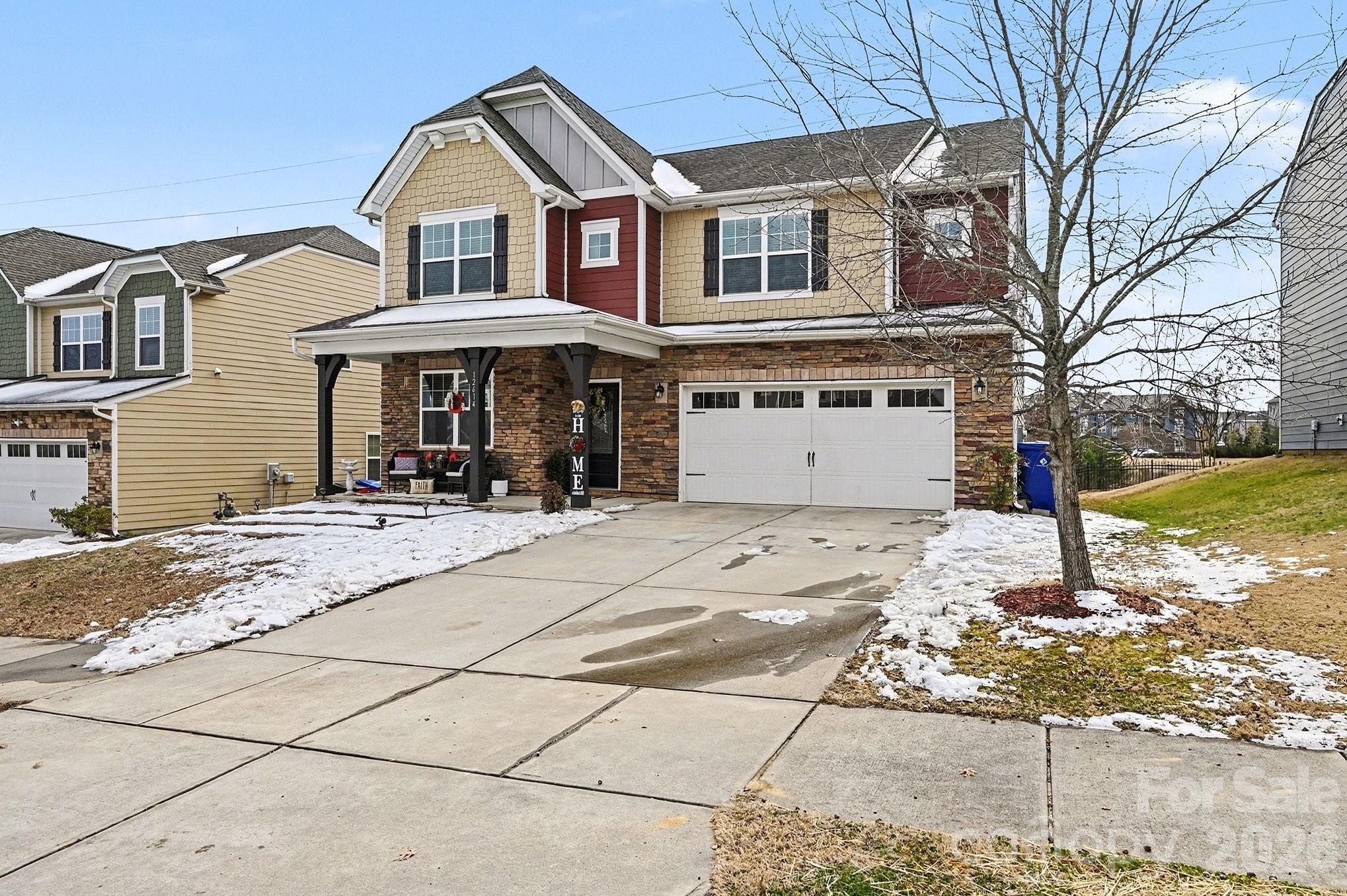 12614 Chantrey Way Huntersville, NC 28078 - Photo 6 of 31 a front view of a house with a yard and garage