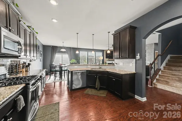 a large kitchen with lots of counter space and a sink