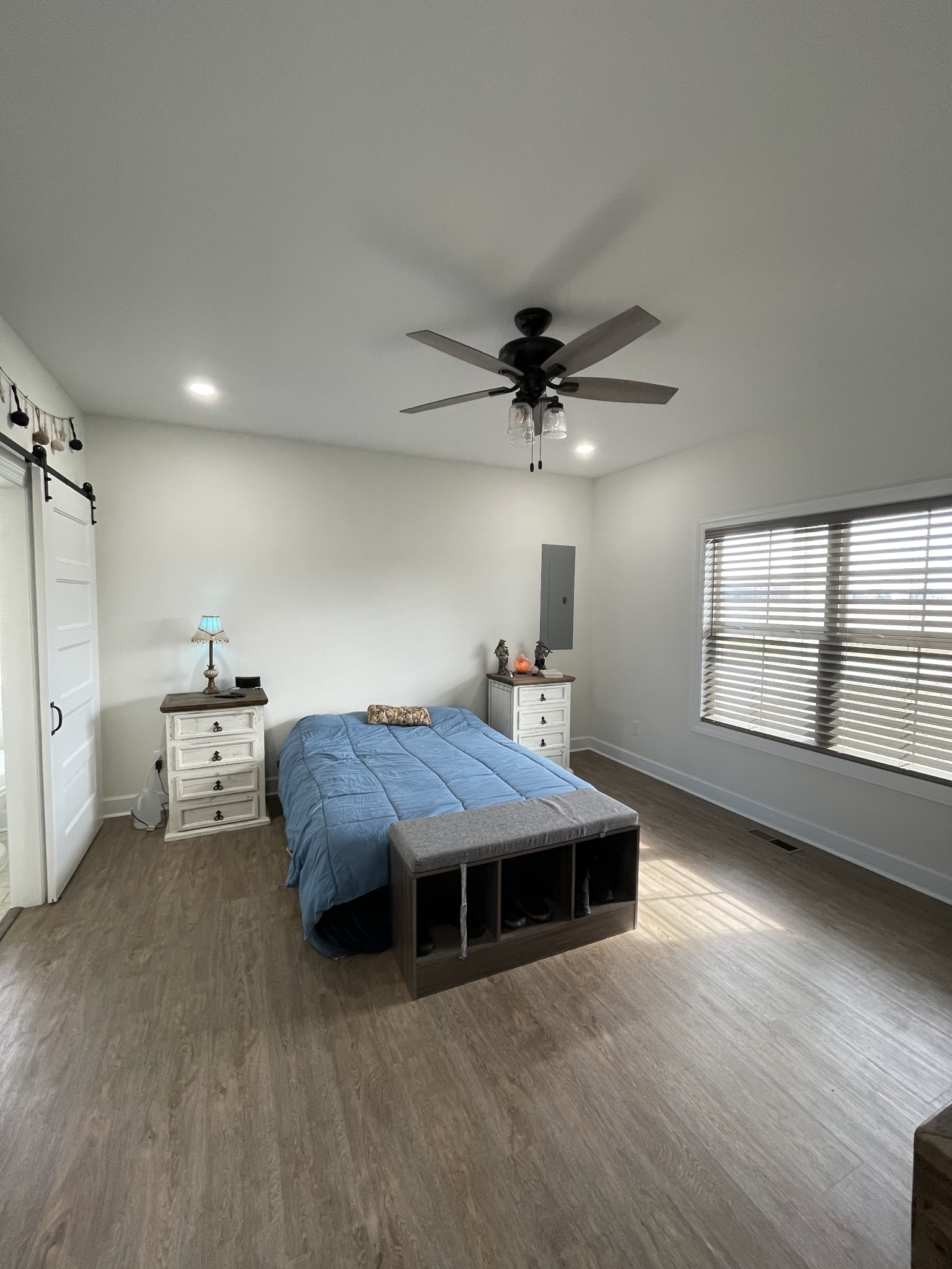 136 Dunn Fall River Road Leoma, TN 38468 - Photo 14 of 25 a room with a bed furniture and a large window